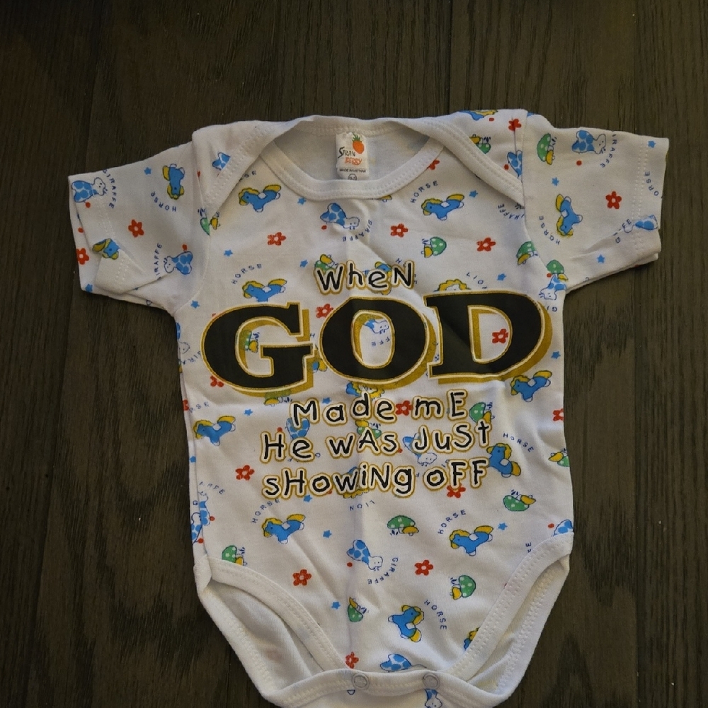 White Baby Onesie with Animal Print & Inspirational Message.